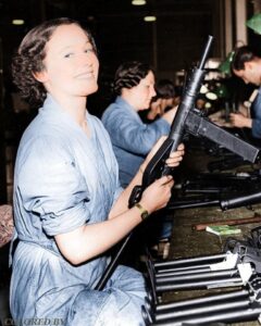 Woman making Sten sub-machine gun in factory